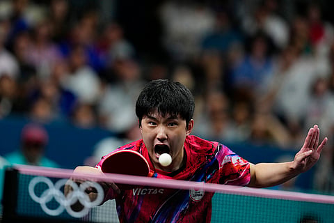 Tomokazu Harimoto plays against Felix Lebrun during men's bronze medal team table tennis match 